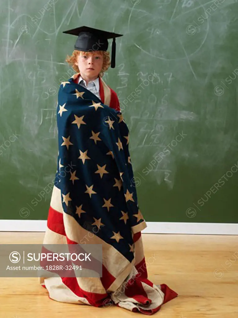 Boy Wearing American Flag and Graduation Hat   