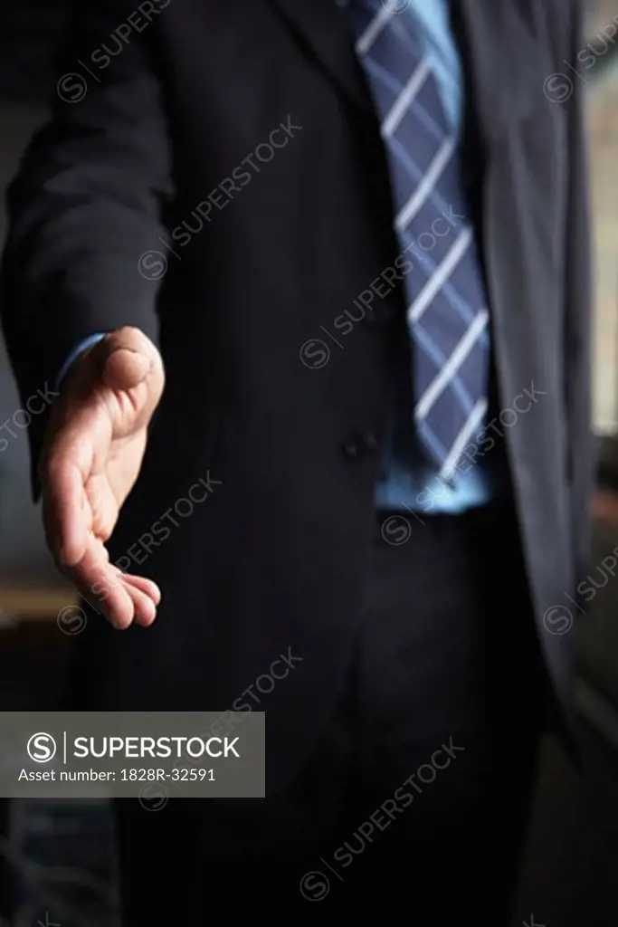 Businessman Extending Hand For Handshake   