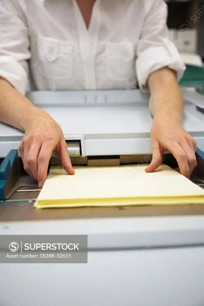 Businesswoman Using Photocopier   