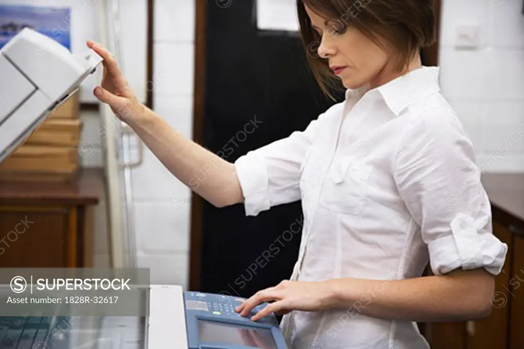 Businesswoman Using Photocopier   