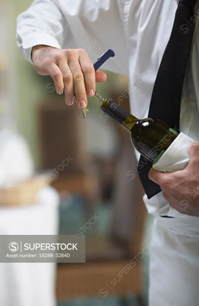 Waiter Opening Bottle of Wine   