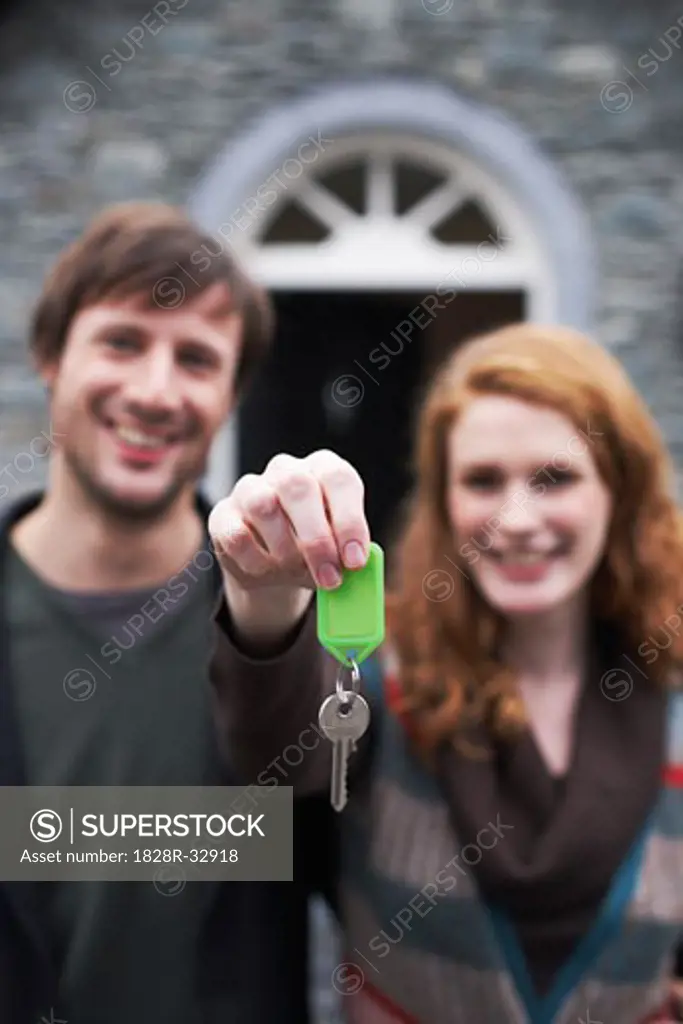 Couple with Key by House   