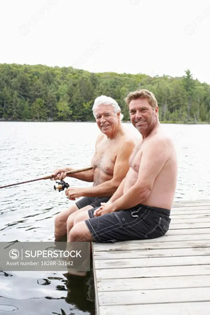 Father and Son Fishing on Dock   
