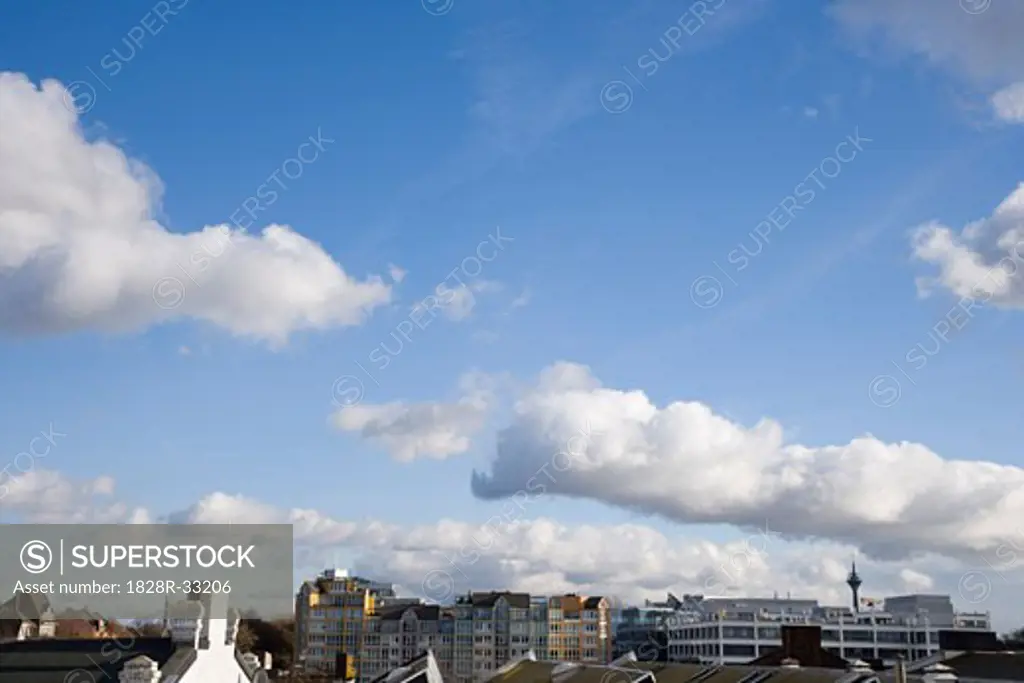 Cityscape and Clouds in Sky   