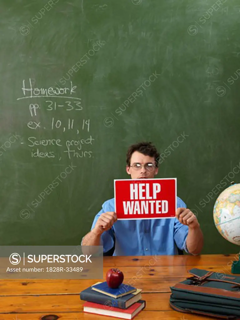 Teacher with Help Wanted Sign   