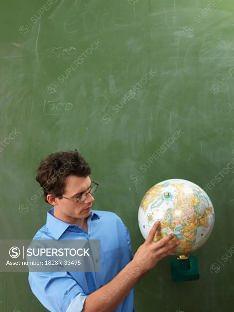 Teacher Looking at Globe   