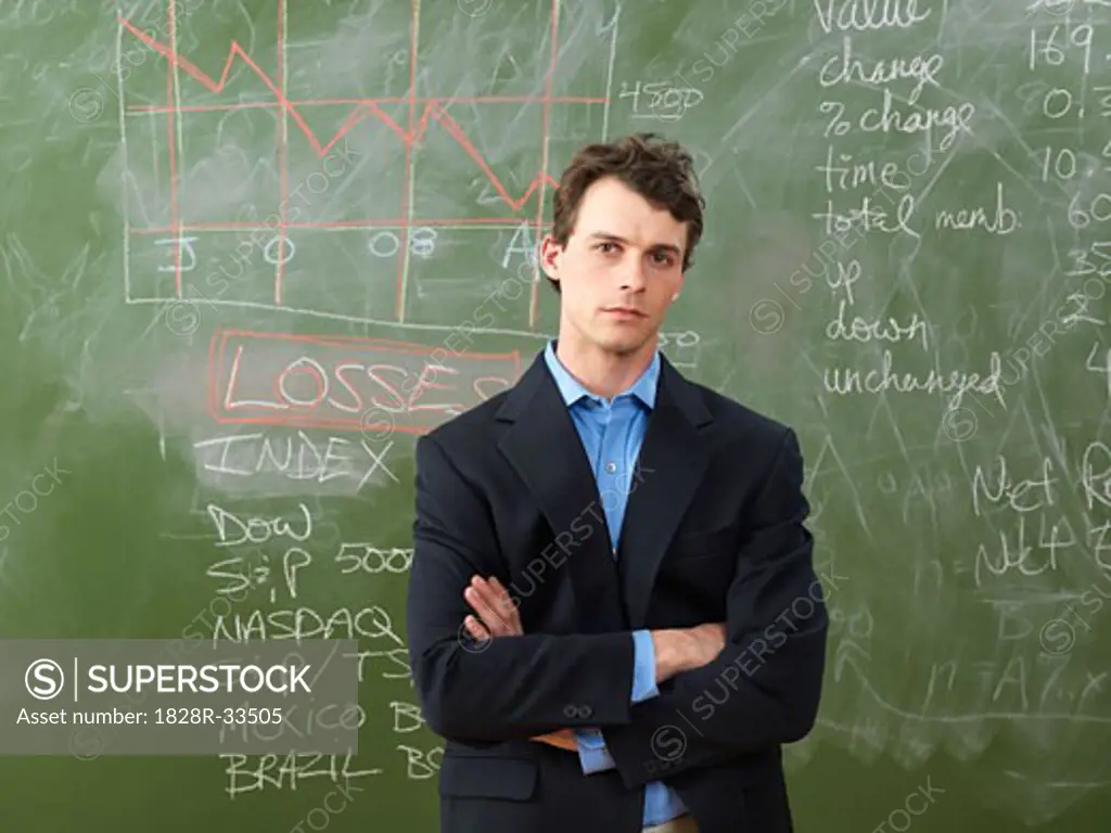 Businessman in Front of Blackboard   