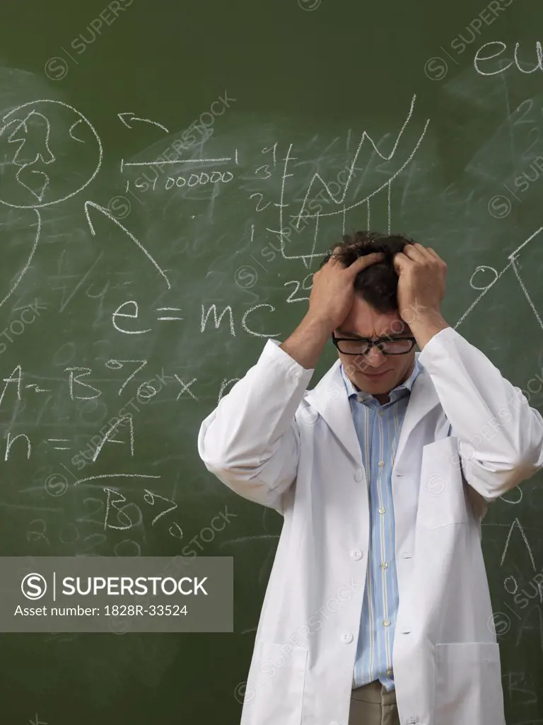 Confused Scientist in Front of Blackboard   