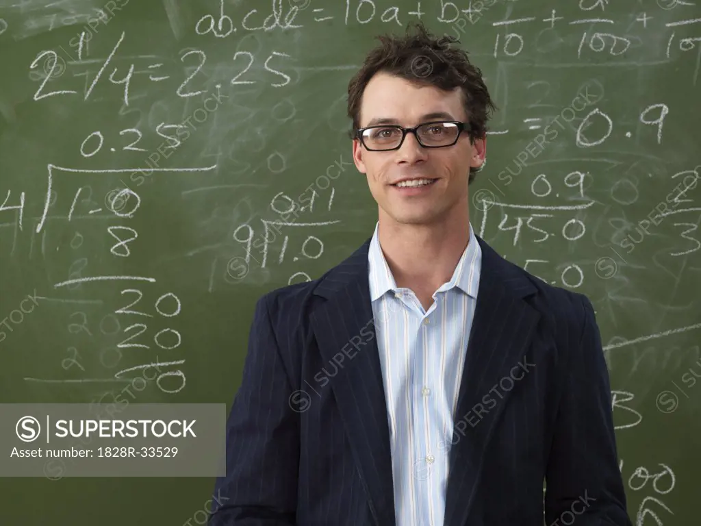 Teacher in Front of Blackboard   