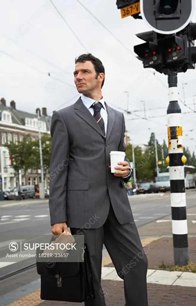 Businessman by Intersection, Amsterdam, Netherlands   