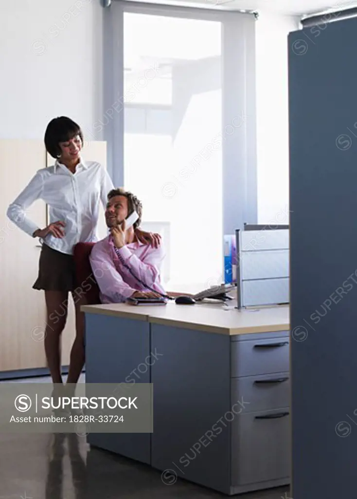 Business People Flirting in Office   