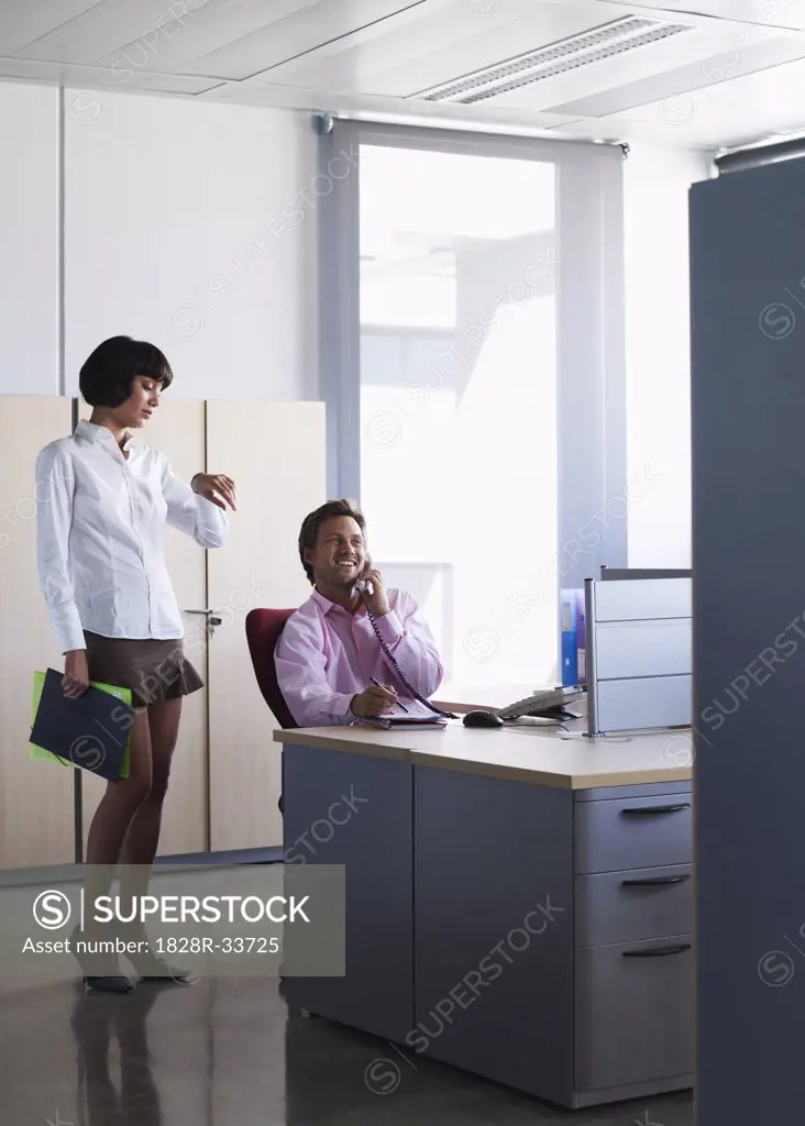 Woman Waiting for Man in Office   