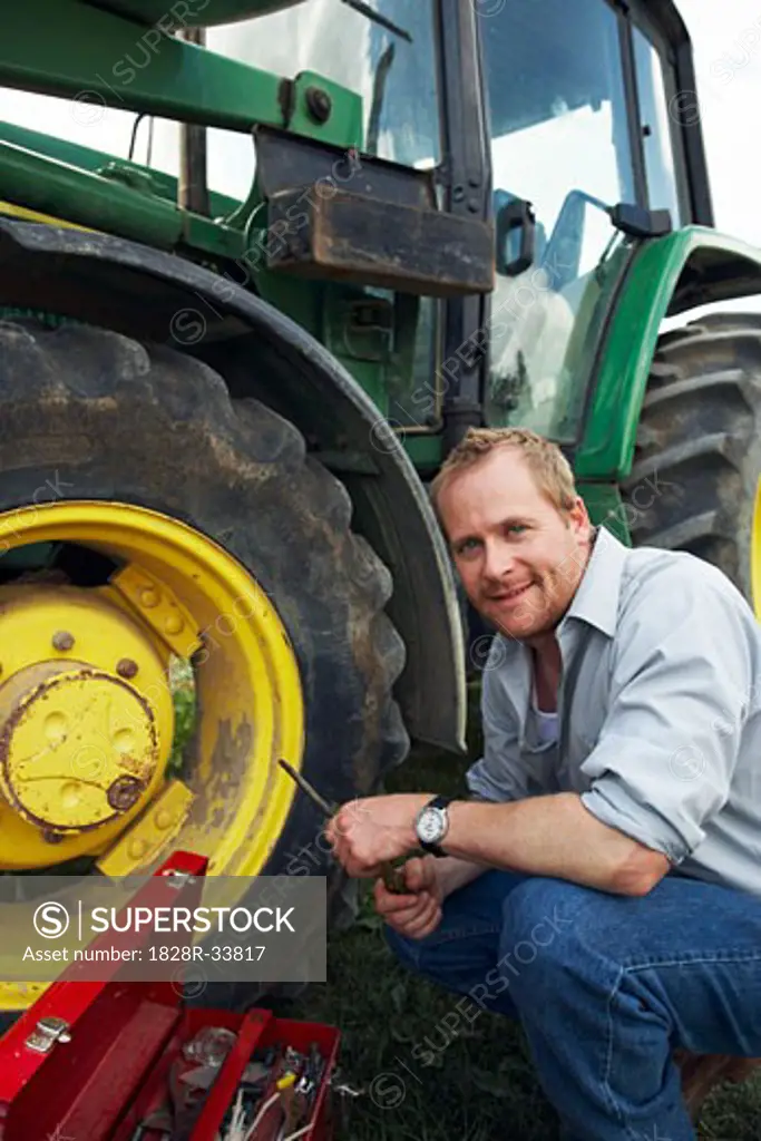 Man Working on Tractor   