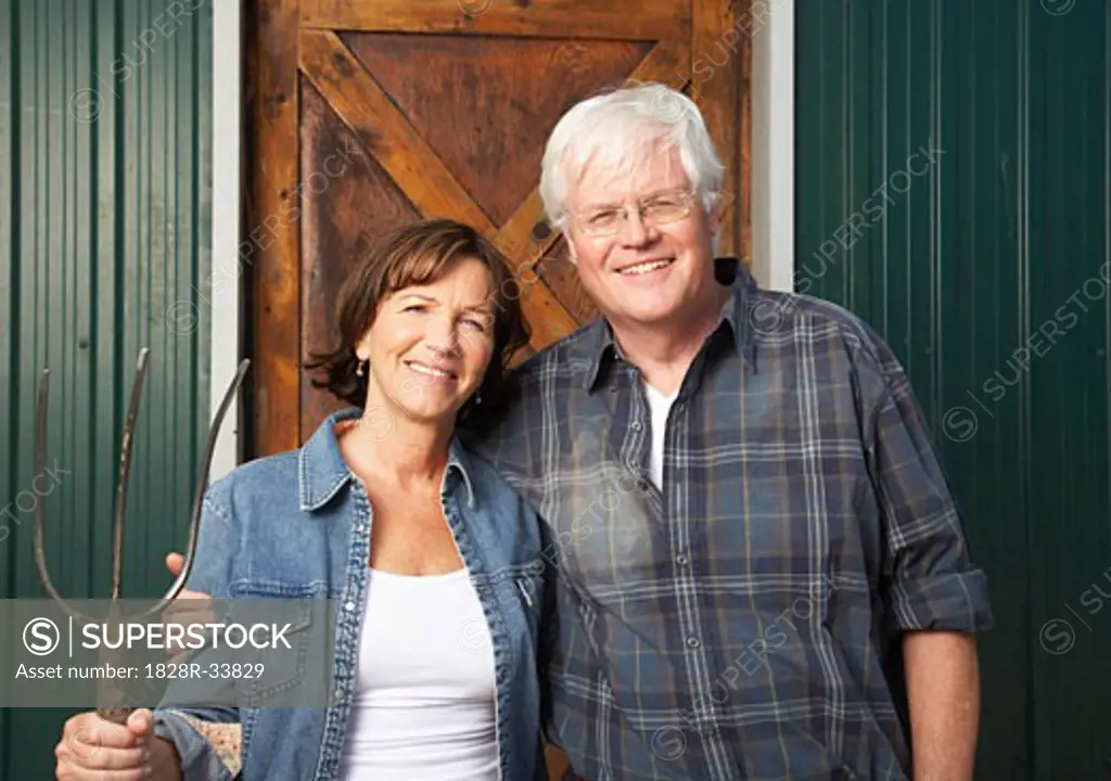 Portrait of Couple by Barn   