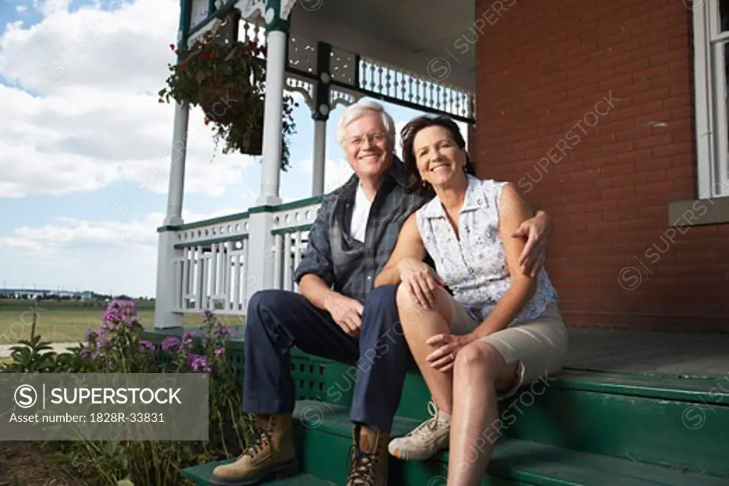 Couple on Porch of Farm House   