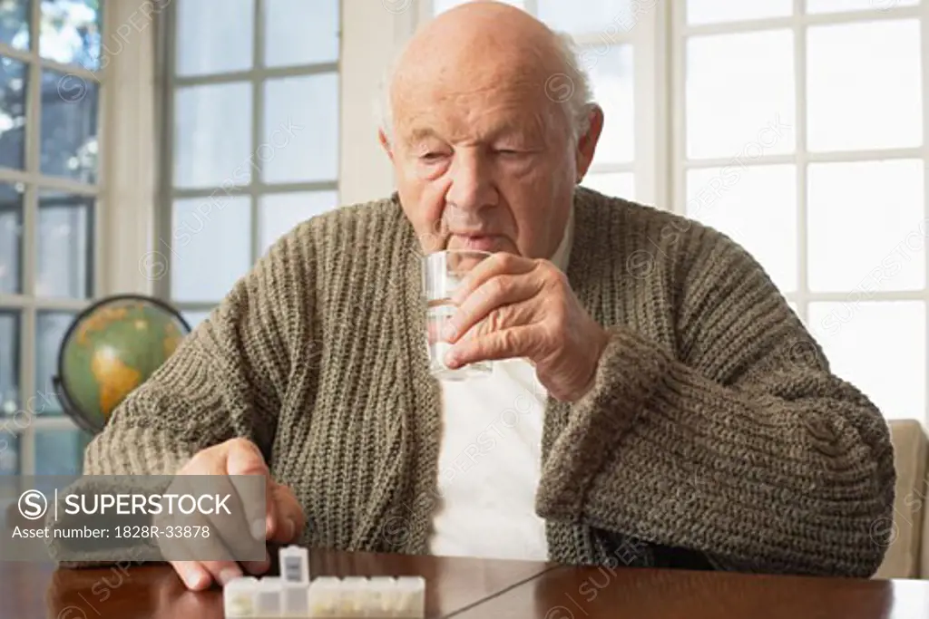 Senior Man Taking Pills   
