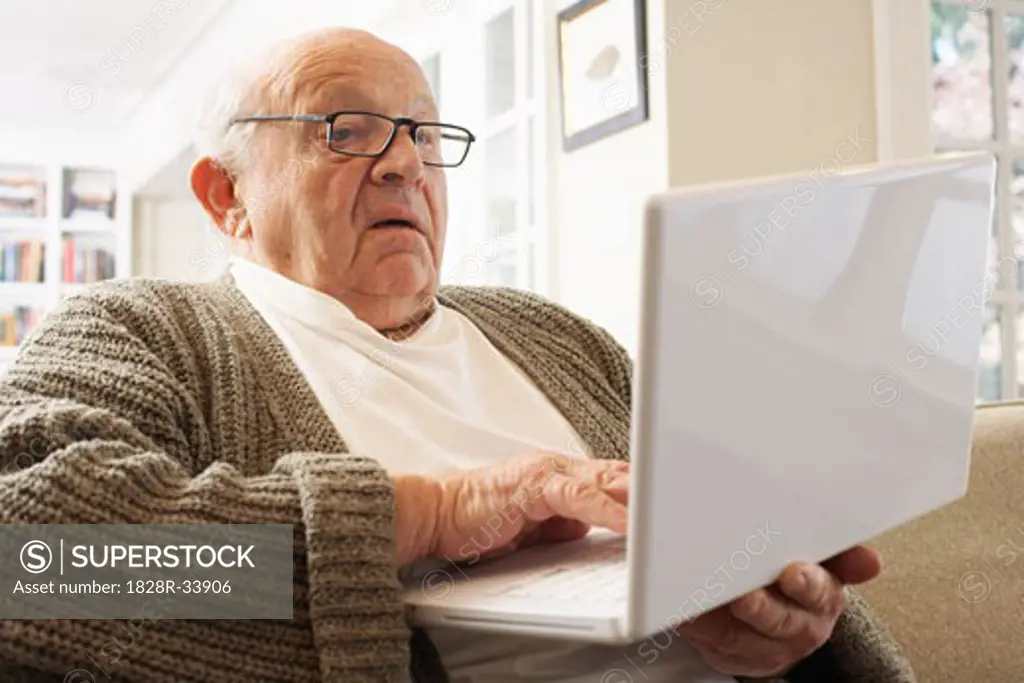 Senior Man Using Laptop Computer   