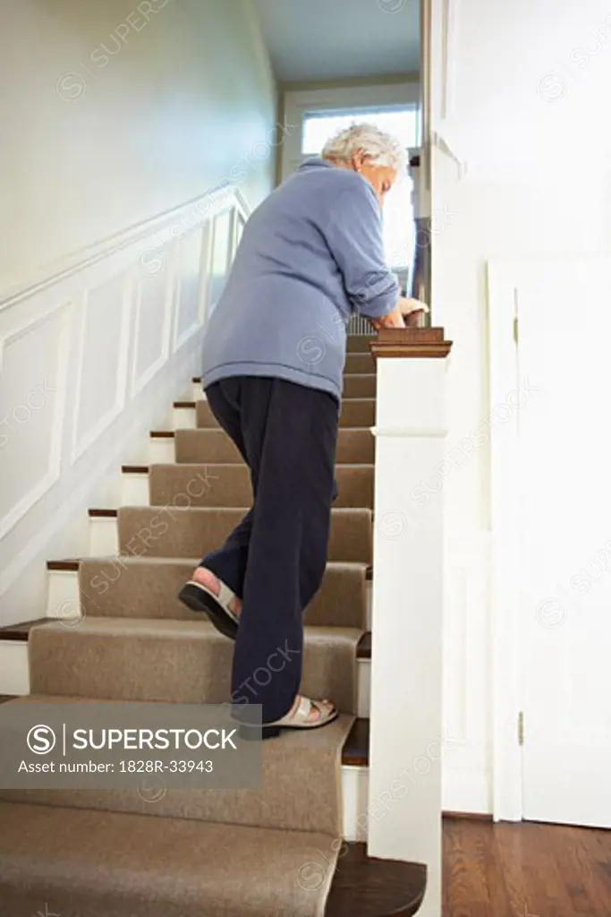 Senior Woman Trying to Walk up Stairs   
