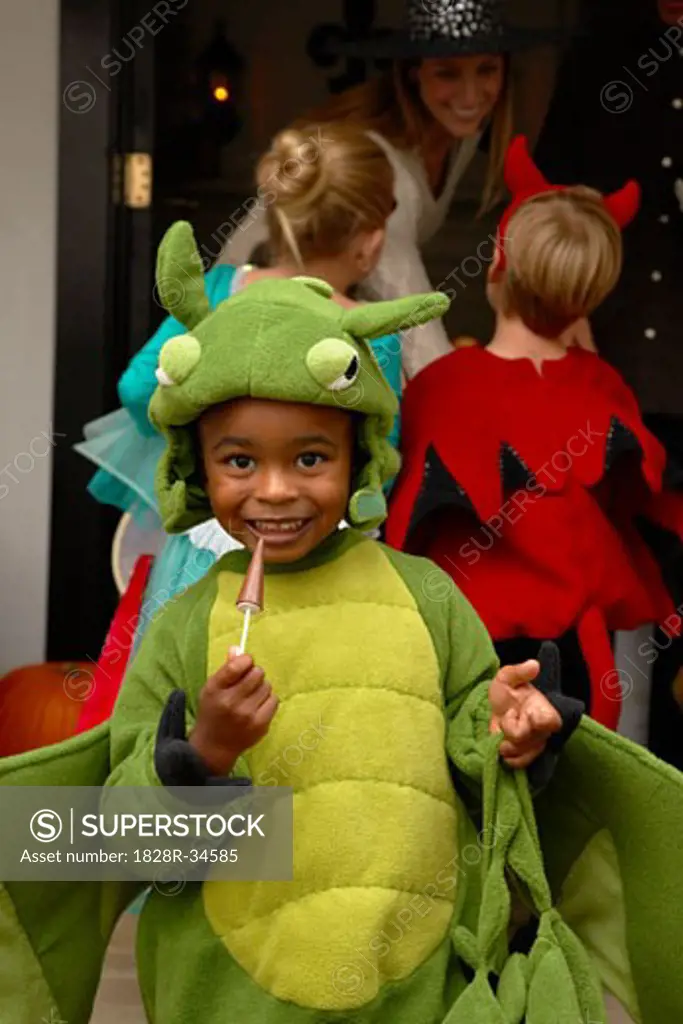 Portrait of Boy with other Children Trick or Treating at Halloween   