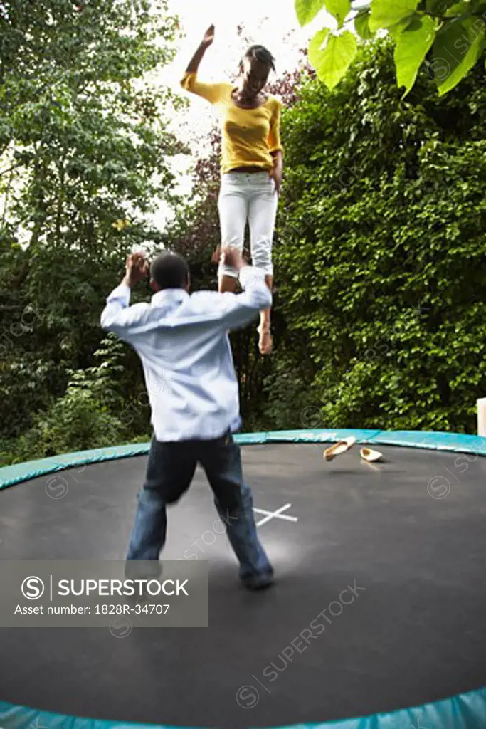 Mother and Son on Trampoline   