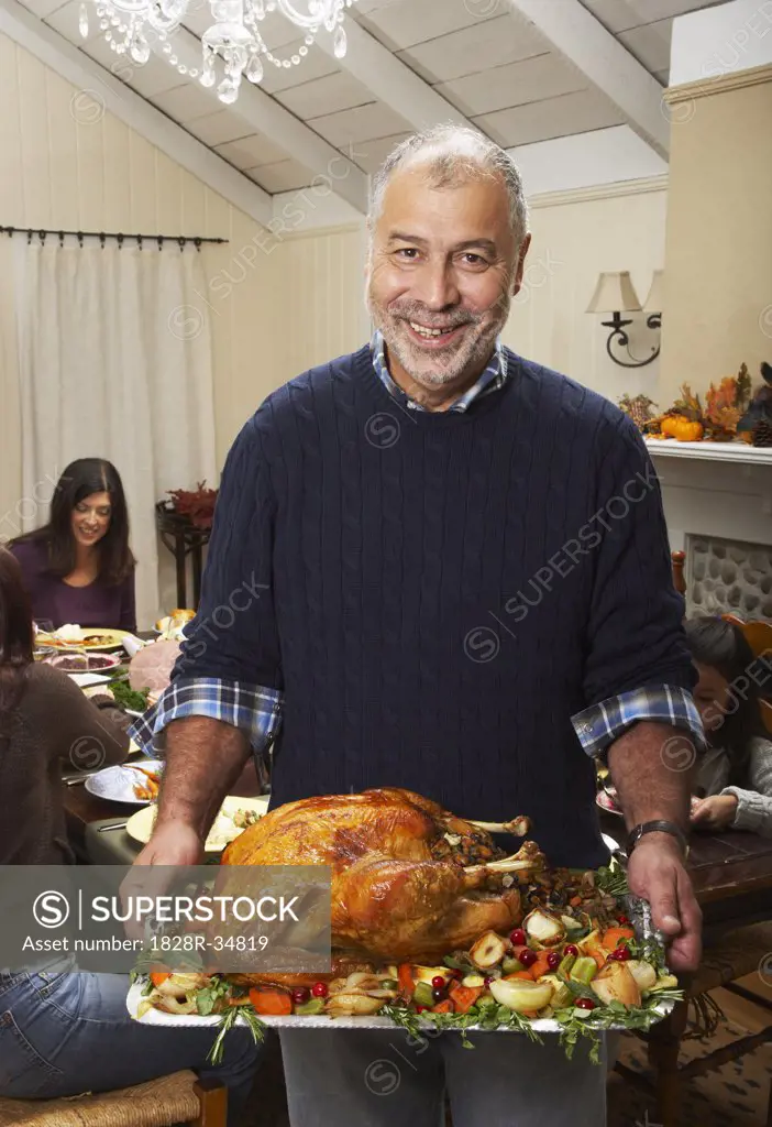 Man Holding Thanksgiving Turkey  