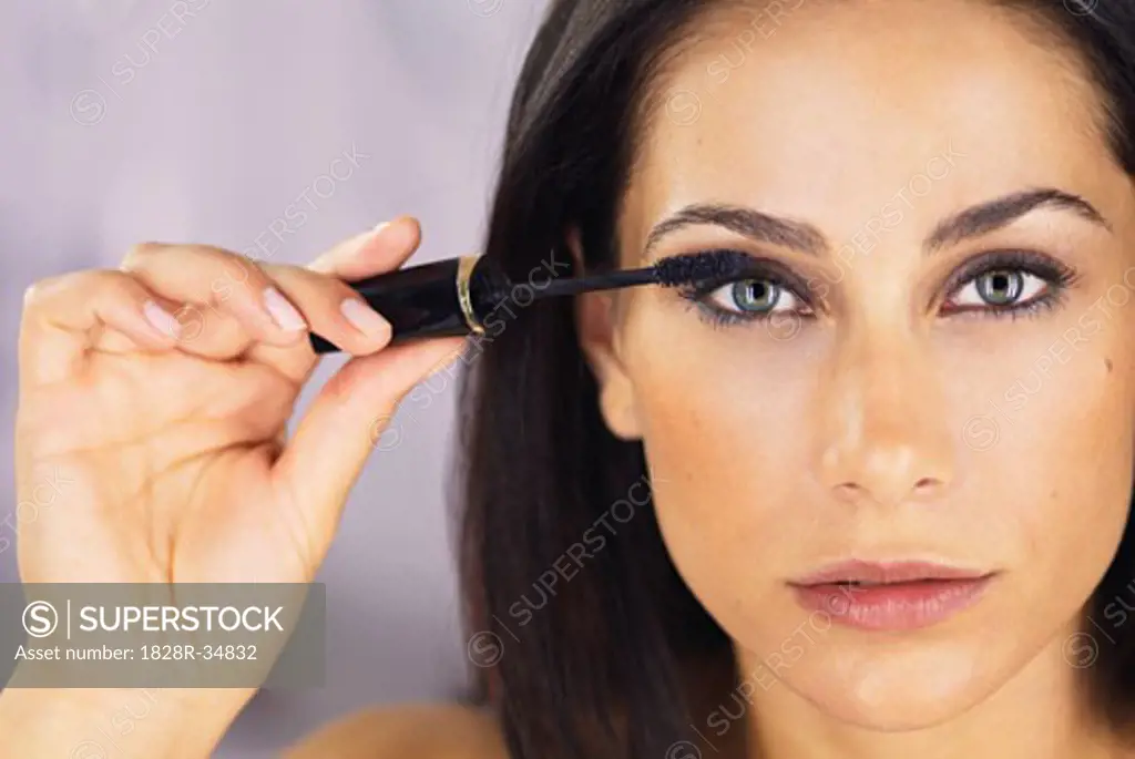 Woman Applying Mascara   