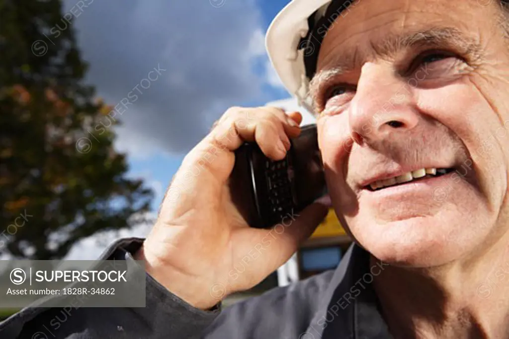 Construction Worker with Cellular Phone   