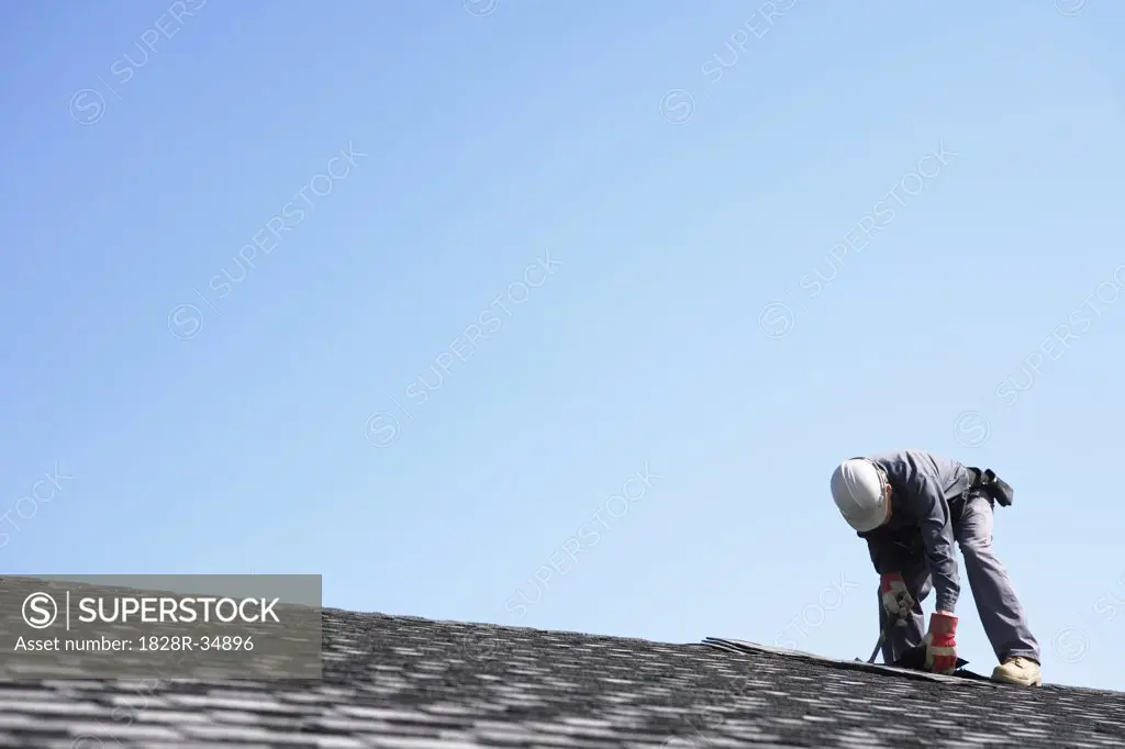 Man Working on Roof   