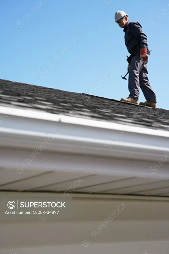 Man Working on Roof   