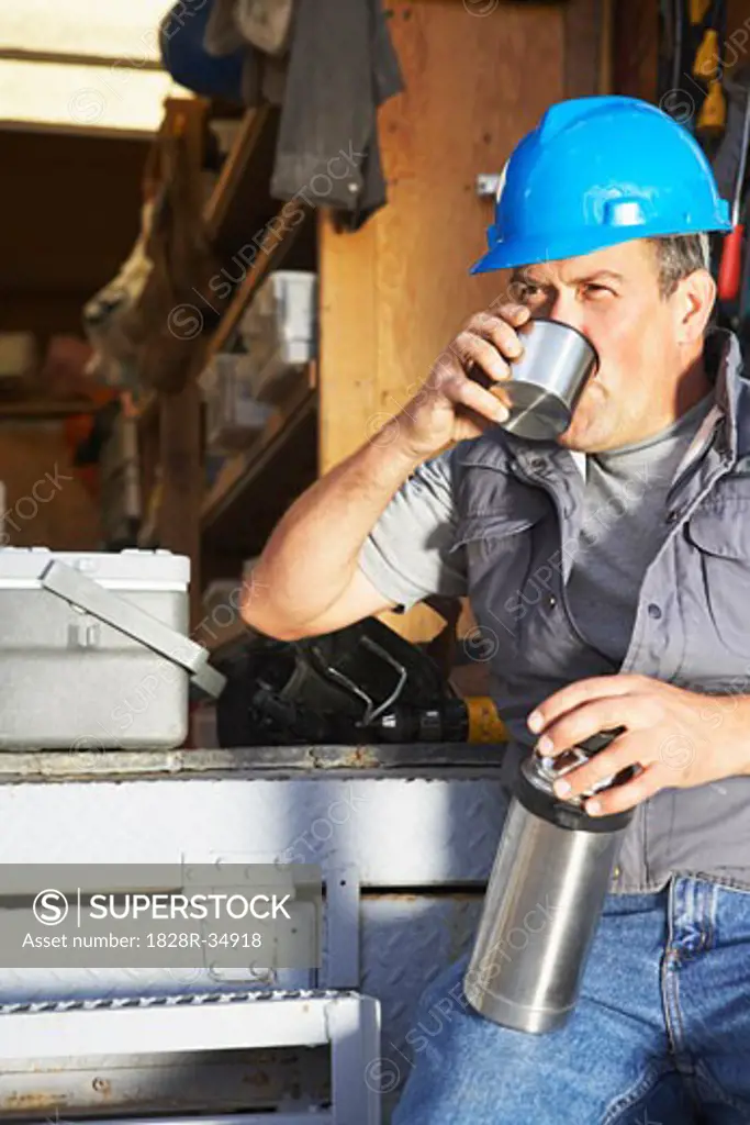 Construction Worker Taking Coffee Break   