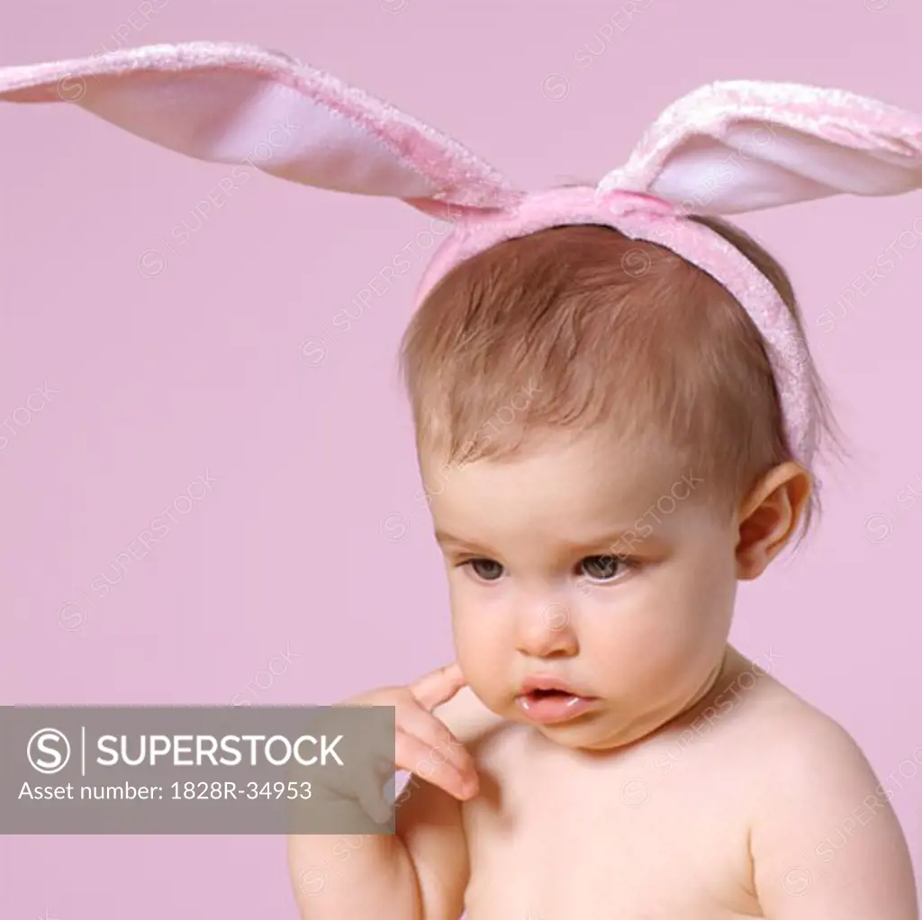 Baby Girl Wearing Pink Bunny Ears   