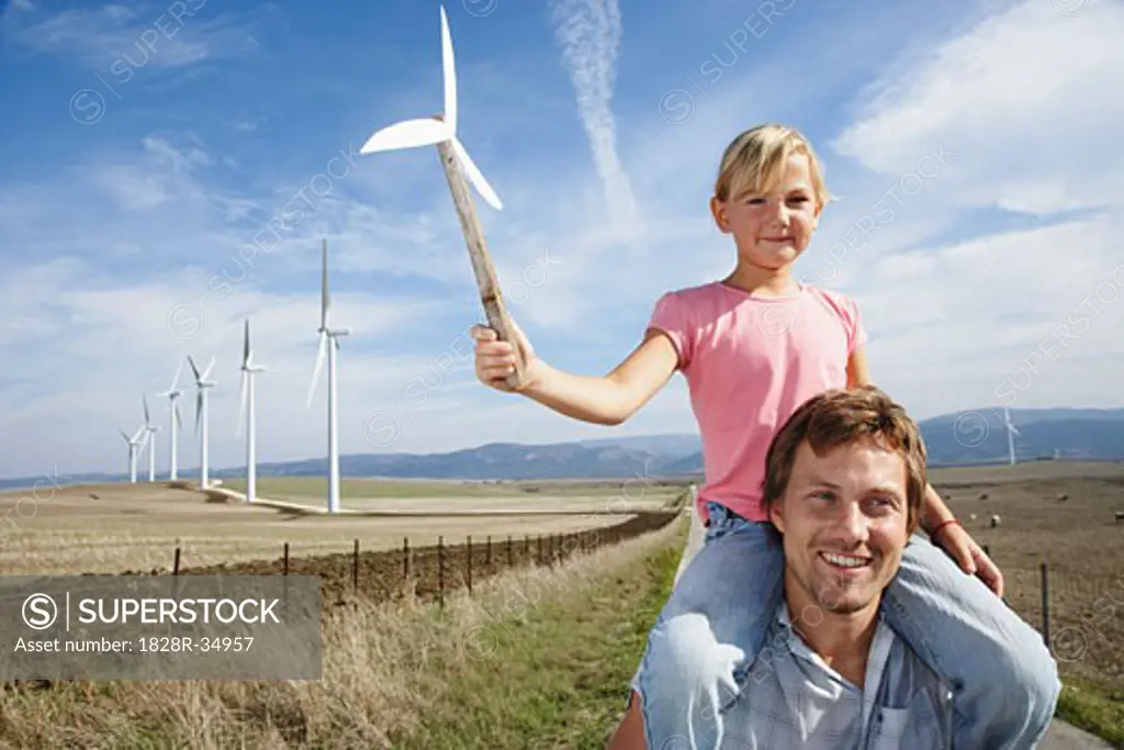 Father and Daughter with Wind Turbines   