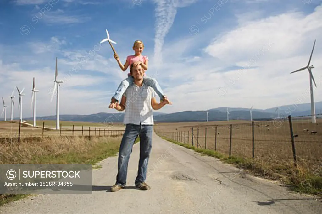 Father and Daughter with Wind Turbines   