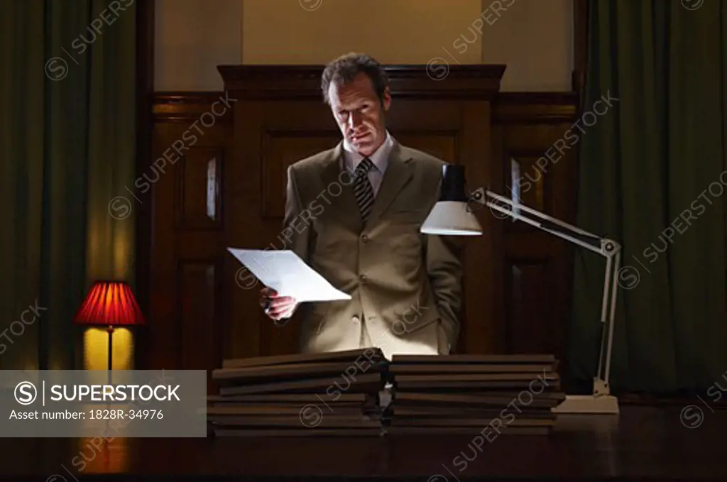 Businessman Looking at Document   