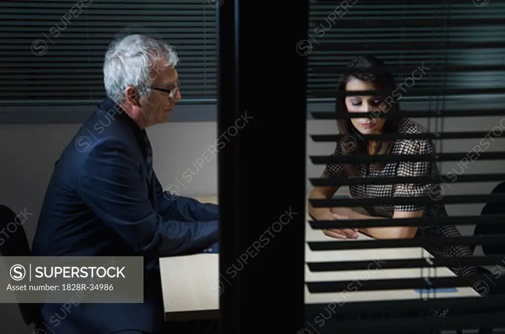 Businessman and Woman in Office   