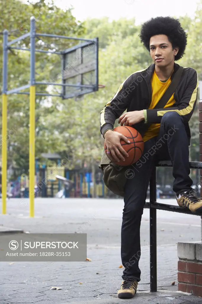 Portrait of Teenaged Boy With Basketball   