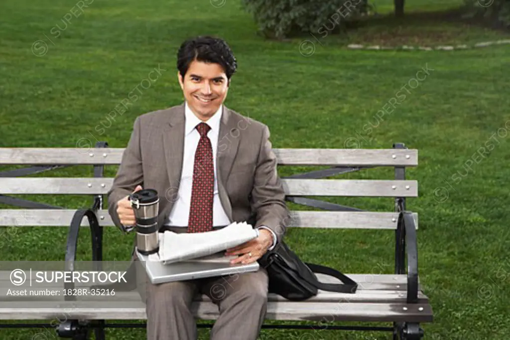Portrait of Businessman on Park Bench, New York City, New York, USA   