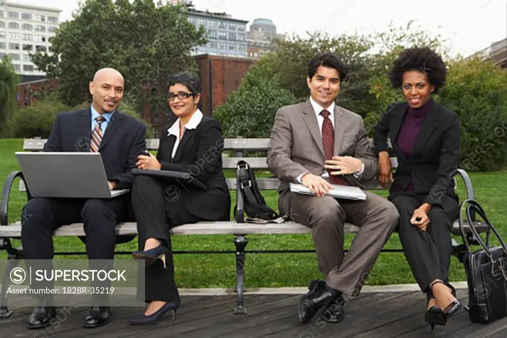 Business People on Park Bench, New York City, New York, USA   