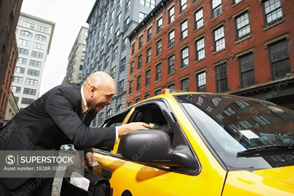 Business People Shaking Hands by Taxi, New York City, New York, USA   