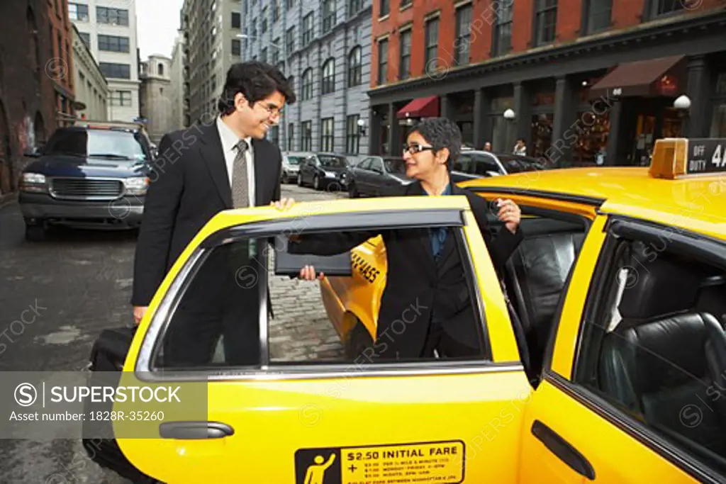 Business People next to Taxi, New York City, New York, USA   