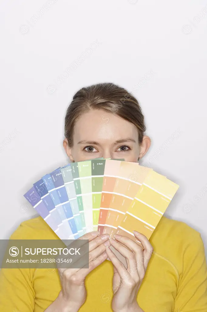 Portrait of Woman Holding Paint Swatches   