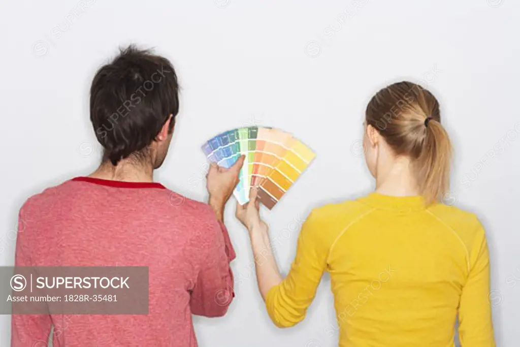 Couple Looking at Paint Swatches   