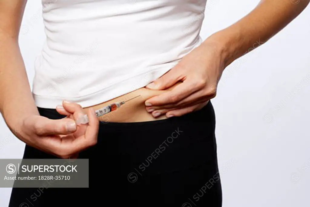 Woman Giving Injection to Self   