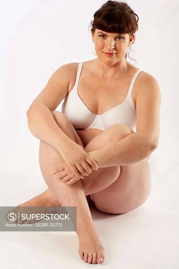Portrait of Woman Sitting on Floor in Underwear   
