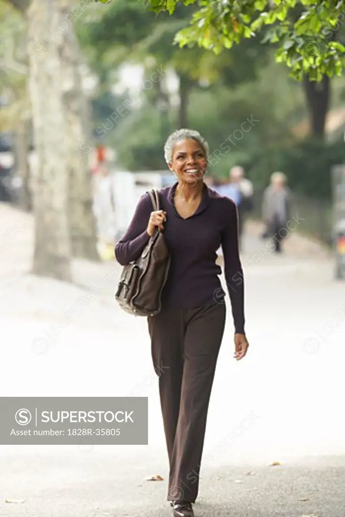 Woman Walking in City, New York City, New York, USA   