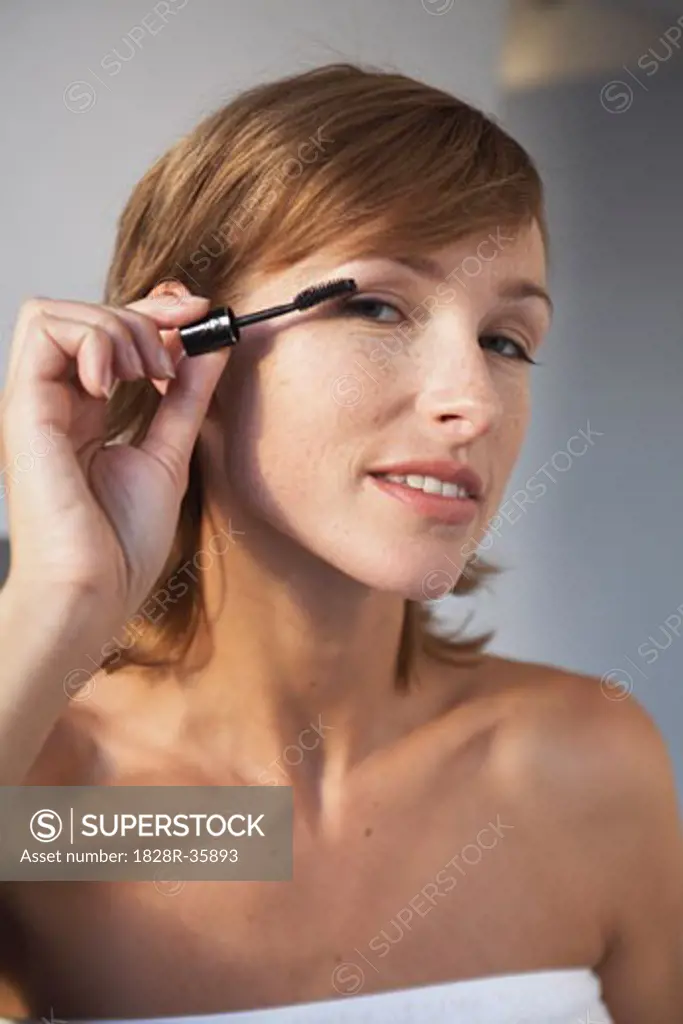 Woman Applying Make-Up   