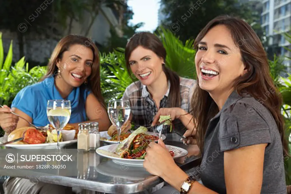 Women Eating in Restaurant   
