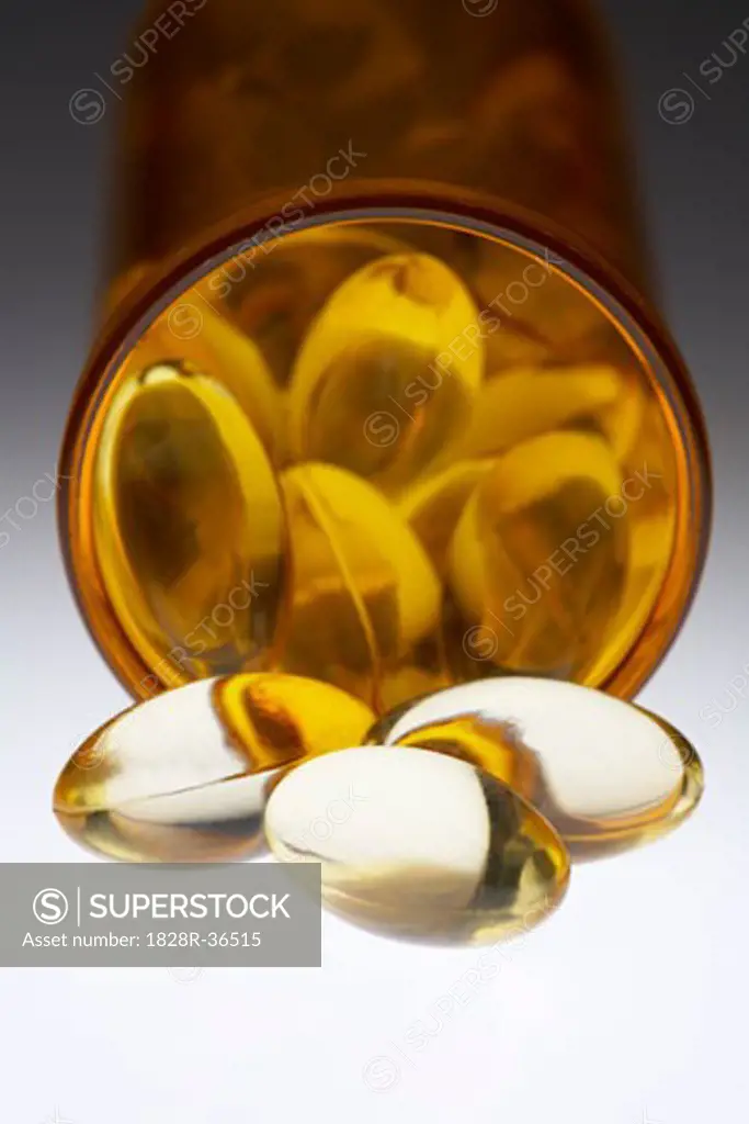 Close-up of Gelatin Pills, Spilling out of Bottle, Vitamin E   