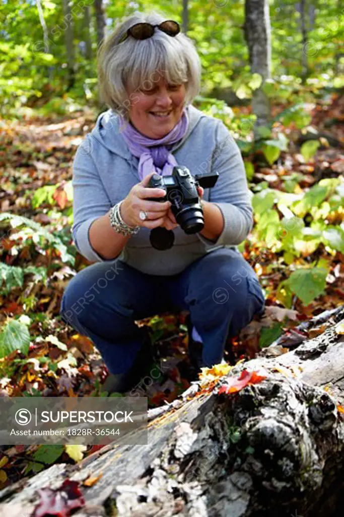 Woman Filming in Forest   