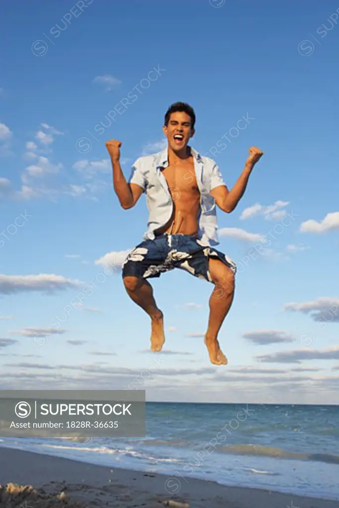 Man Jumping on the Beach   